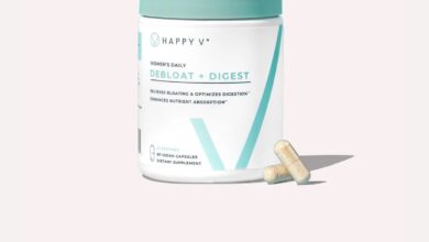 Happy V Debloat + Digest supplement bottle on a gray background