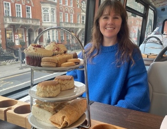 Afternoon tea laid out on a London sightseeing bus