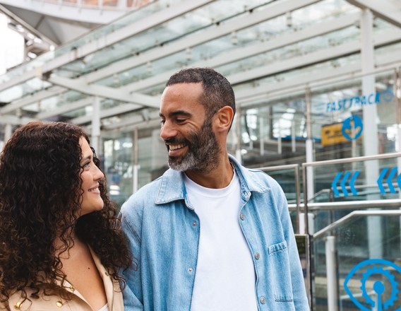 A couple arriving at a London attraction entrance
