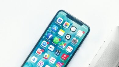 iPhone beside a laptop