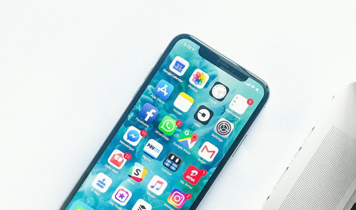 iPhone beside a laptop