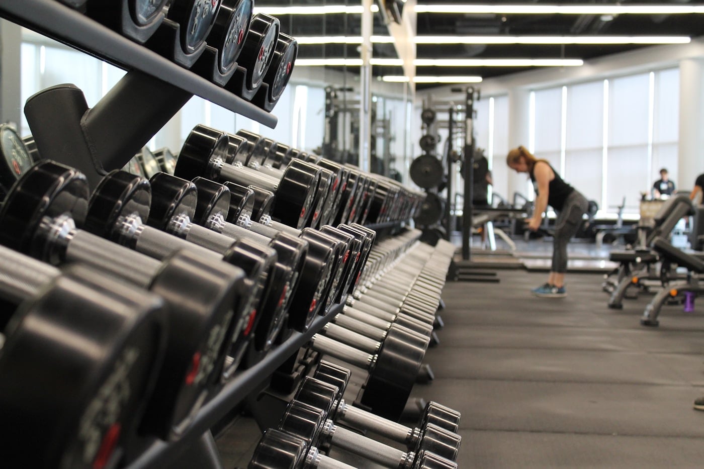 Person exercising in a modern gym as part of an active routine