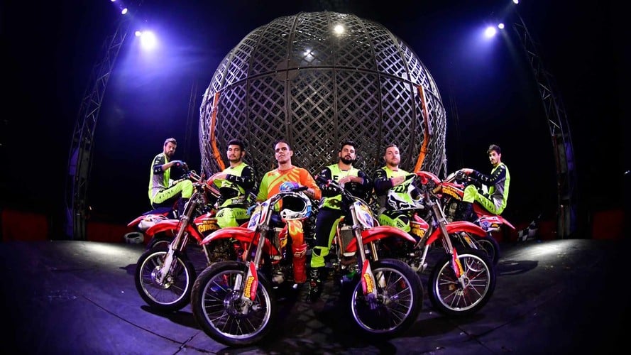 Motorcyclists performing inside Planet Circus