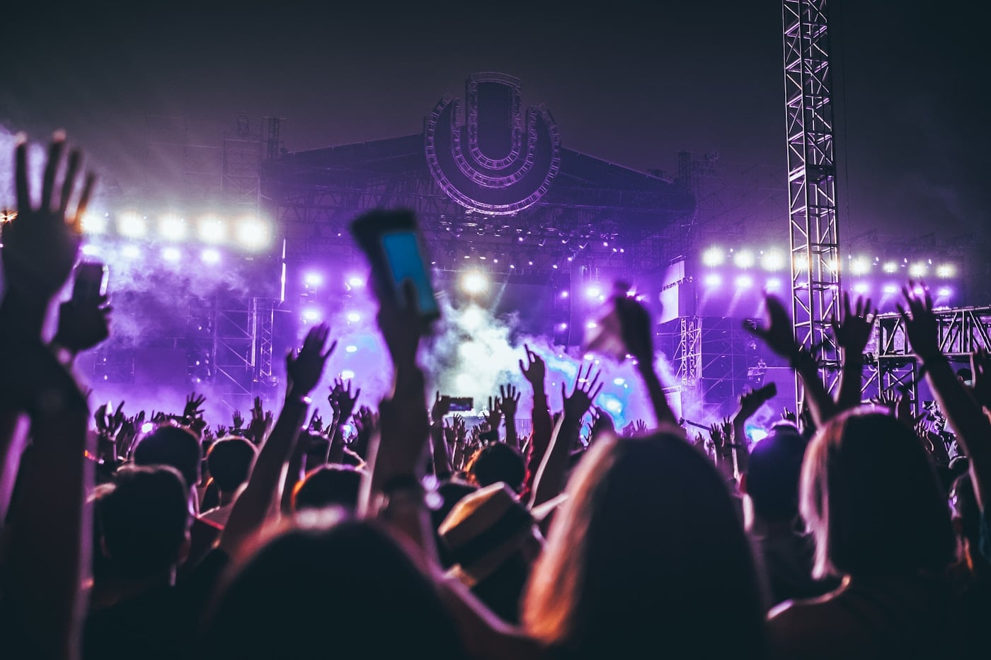 Concert crowd gathered in front of a lit stage