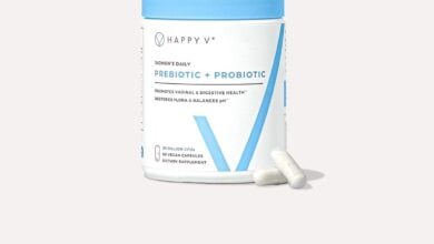 Happy V Prebiotic + Probiotic bottle with capsules on a pale gray background