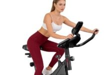 Woman riding a Home Fitness Code indoor exercise bike