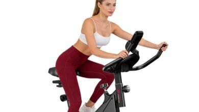Woman riding a Home Fitness Code indoor exercise bike