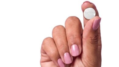 A hand holding a tablet for PillSorted’s Wegovy pill service