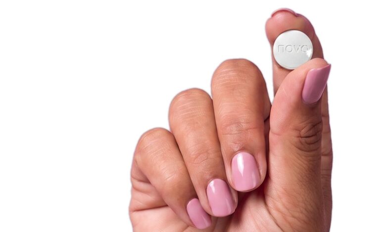A hand holding a tablet for PillSorted’s Wegovy pill service