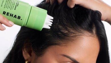 Model applying REHAB Matcha Scalp Serum