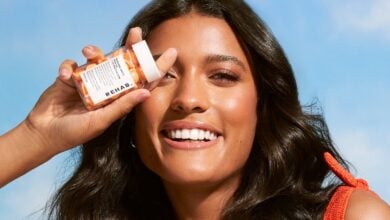REHAB Sunshine Spritz hair oil in a styled product scene