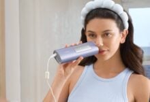 Woman holding a Ulike IPL handset
