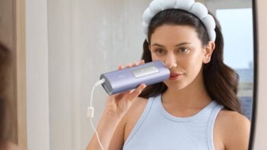 Woman holding a Ulike IPL handset