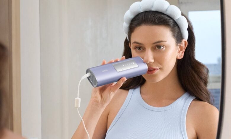 Woman holding a Ulike IPL handset